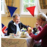 Villagers enjoying tea and raising money for the Red Cross